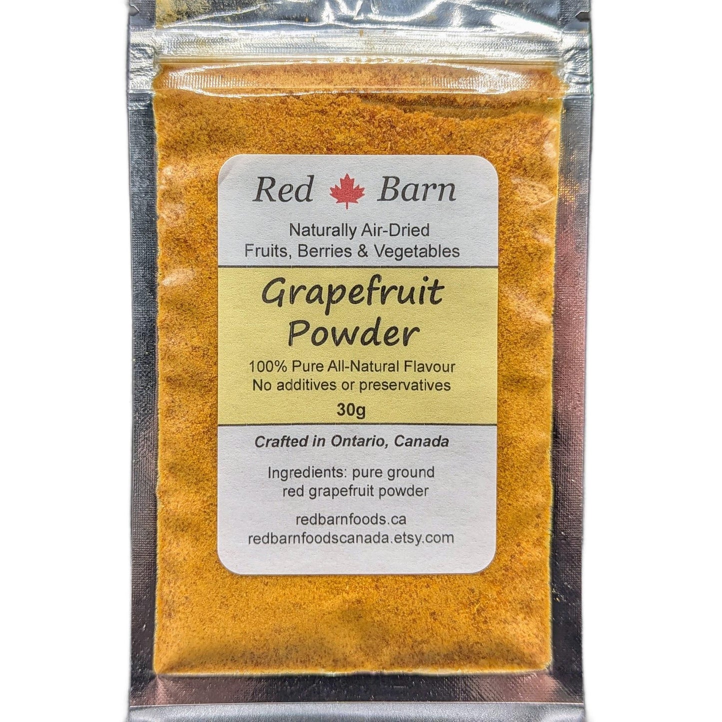 Packaged grapefruit powder with a label on a white background