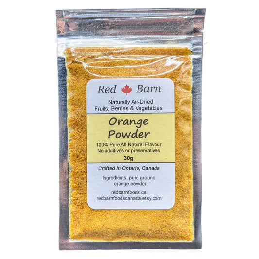 Packaged orange powder with Red Barn label on a white background