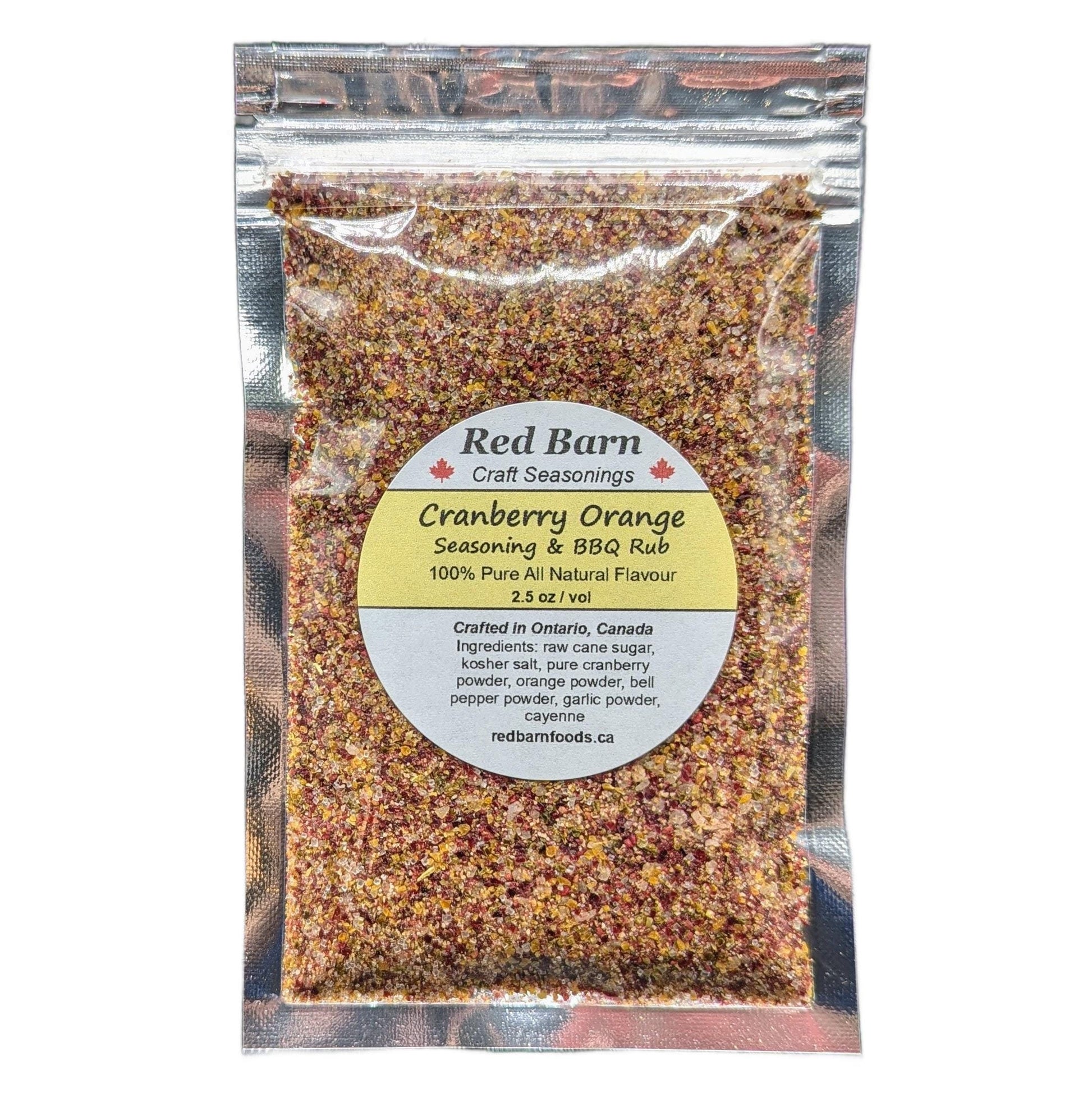 Packaged cranberry orange seasoning & BBQ rub from Red Barn Craft Seasonings on a white background.