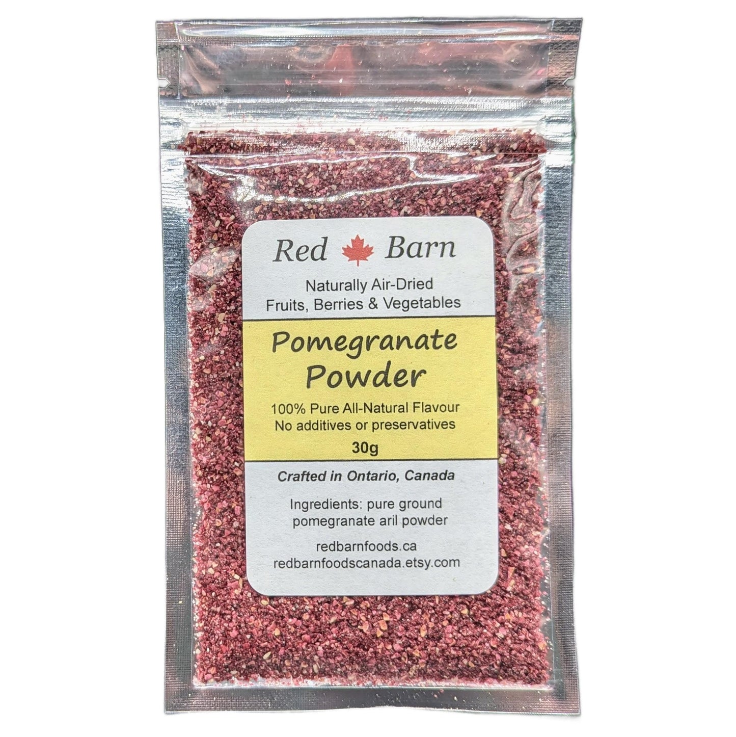 Packaged pomegranate powder with Red Barn label on a white background