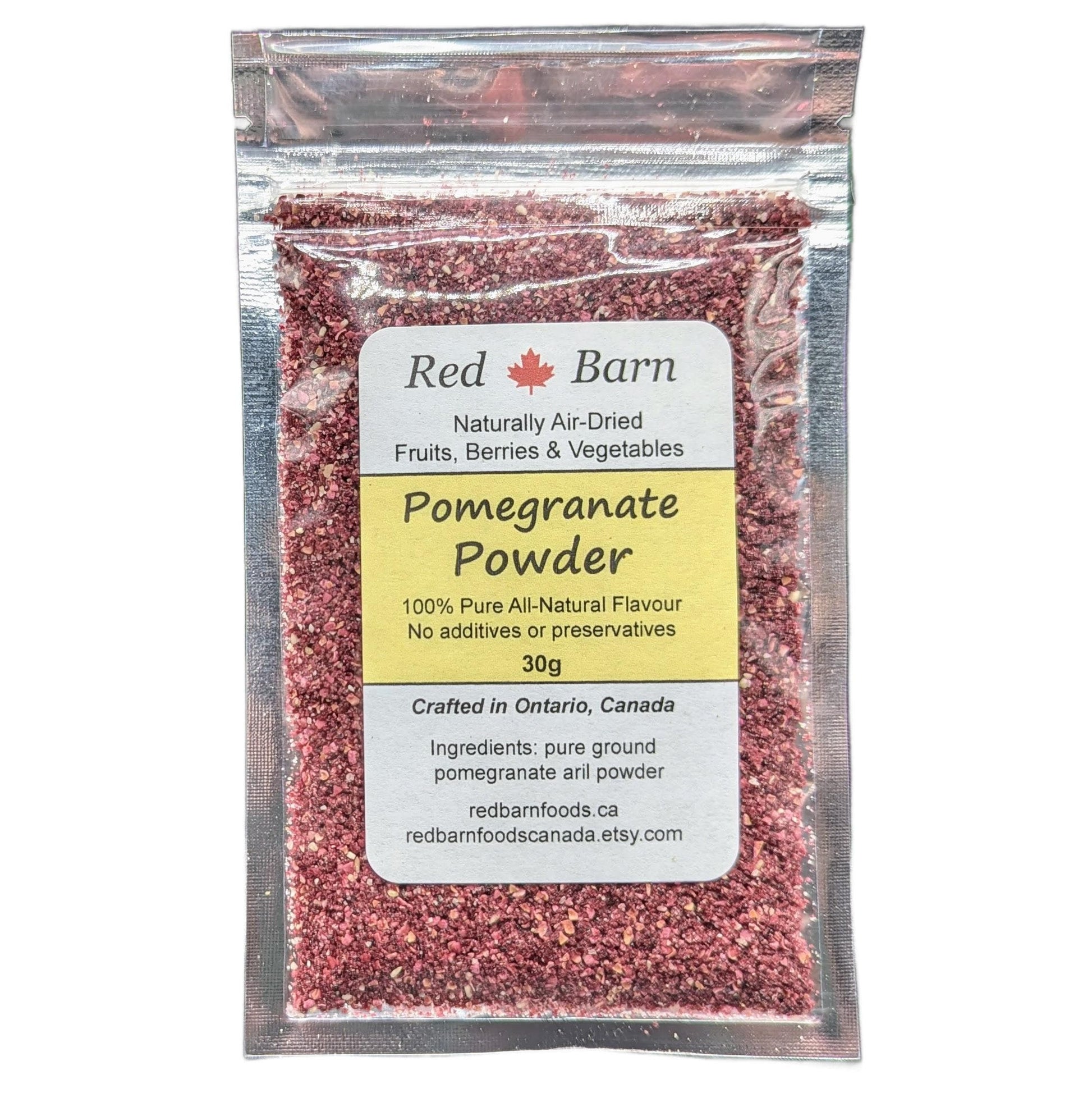 Packaged pomegranate powder with Red Barn label on a white background