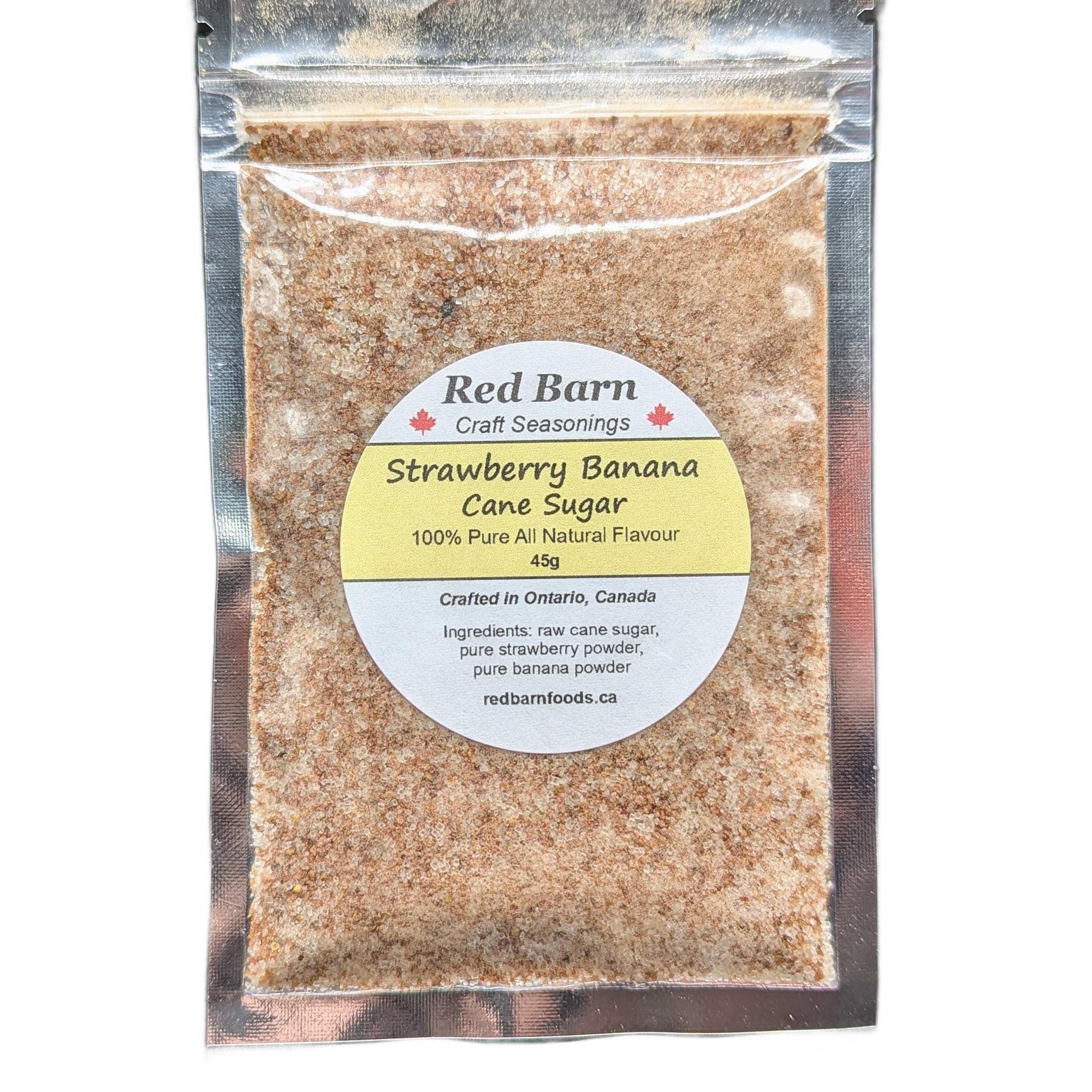 Packaged strawberry banana cane sugar with Red Barn label on a white background