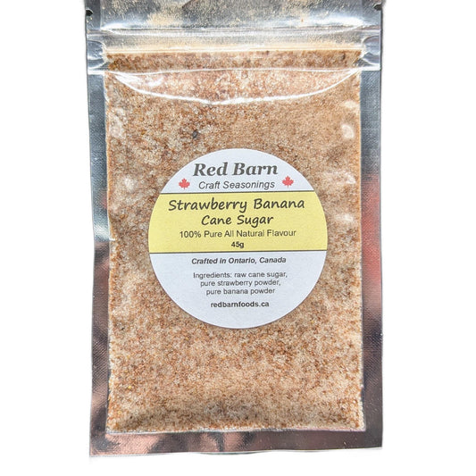 Packaged strawberry banana cane sugar with Red Barn label on a white background