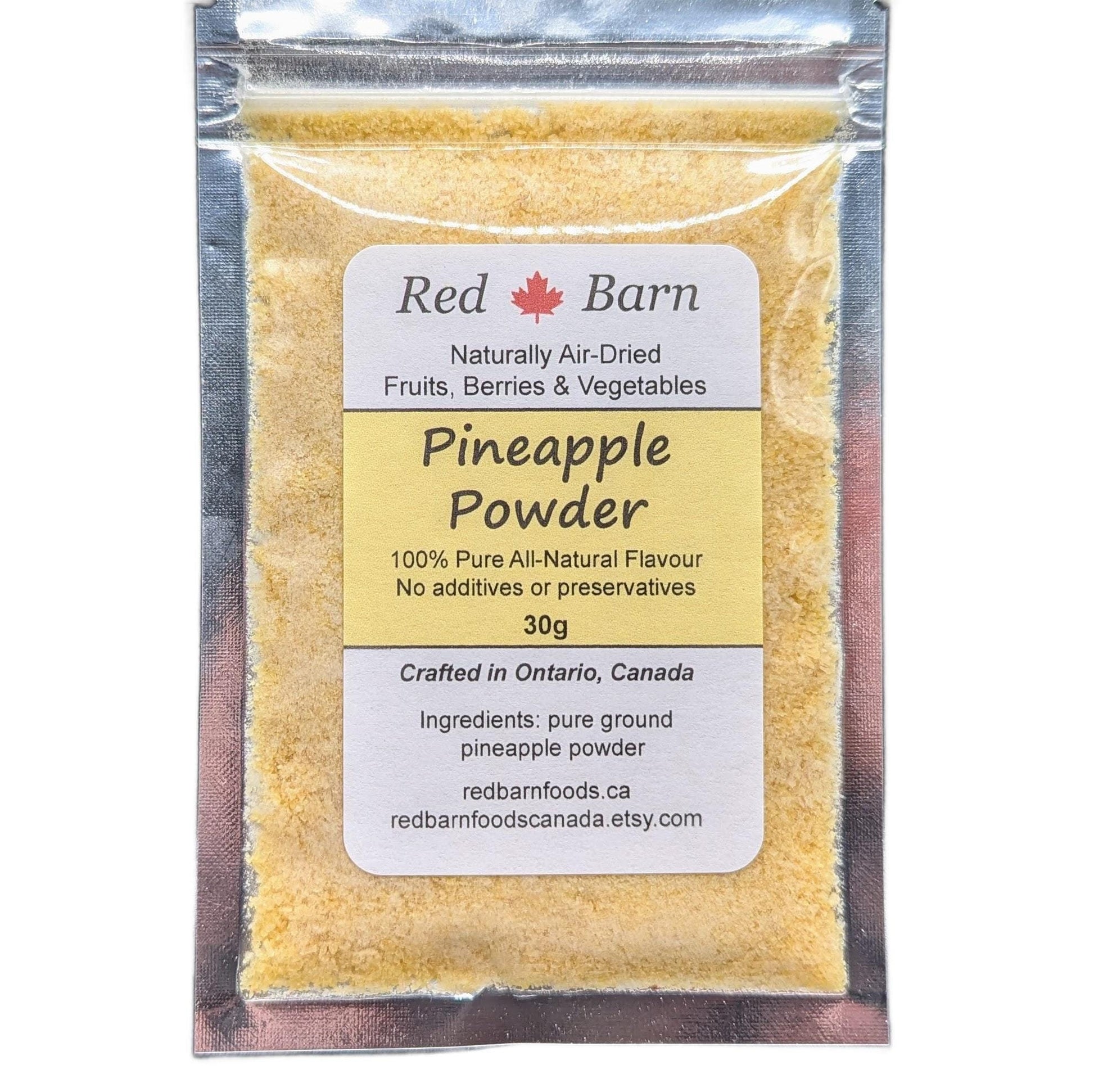 Packaged pineapple powder with Red Barn label on a white background