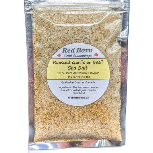 Packaged roasted garlic and basil sea salt with Red Barn Craft Seasonings label on a white background