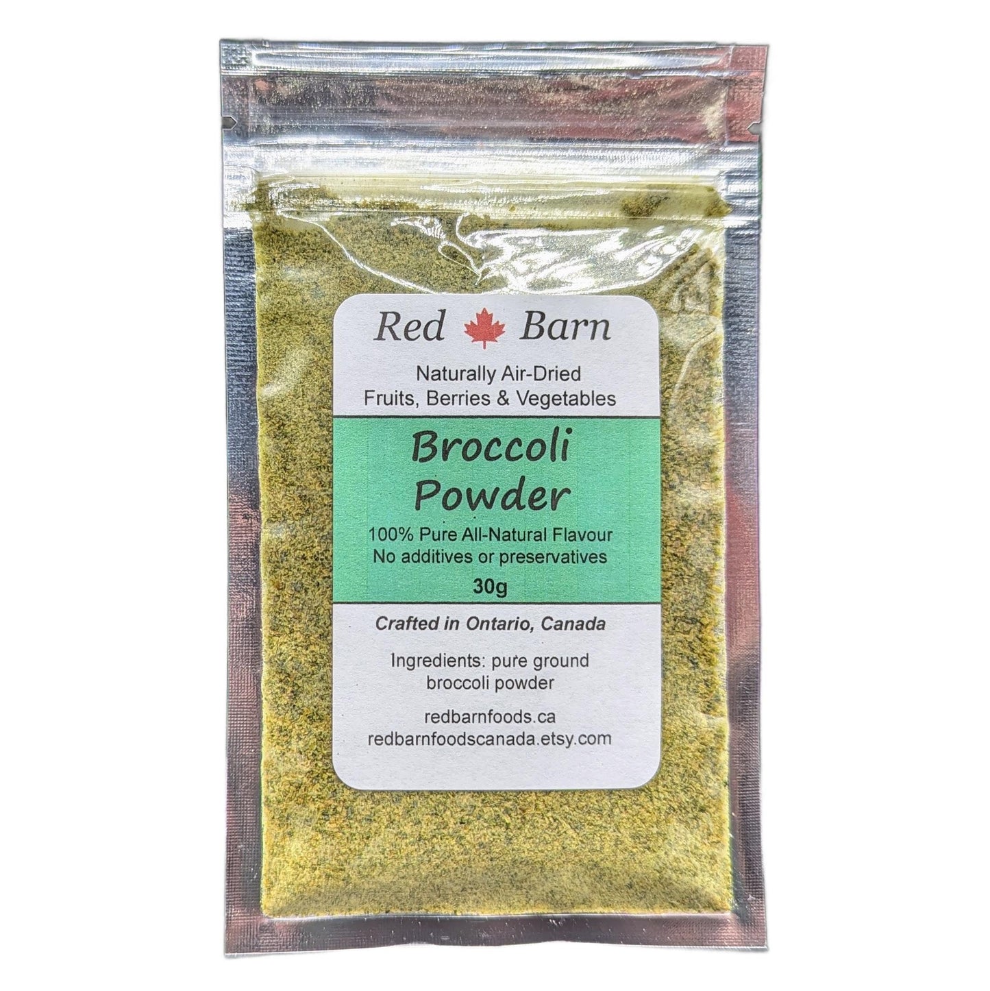 Packaged broccoli powder with Red Barn label on a white background