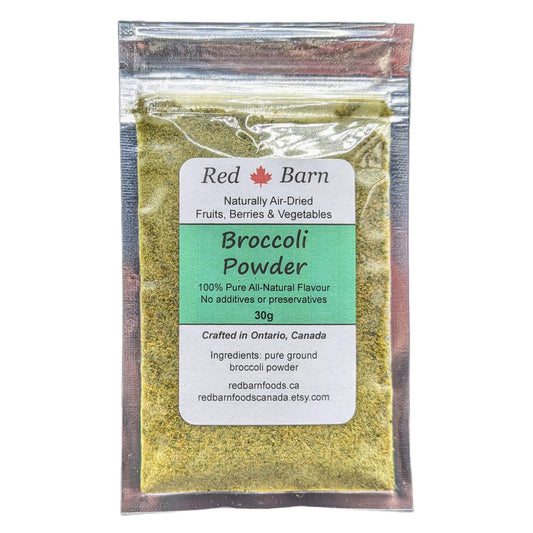 Packaged broccoli powder with Red Barn label on a white background